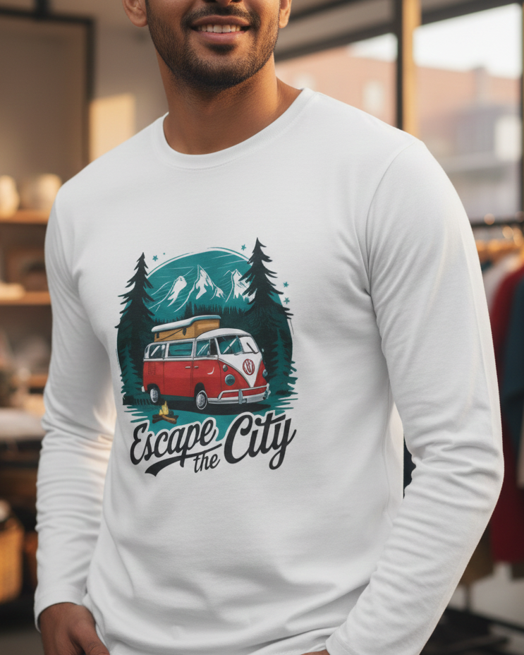 Man wearing a white long-sleeve shirt with a graphic design of a van and trees, text 'Escape the City', in a clothing store.
