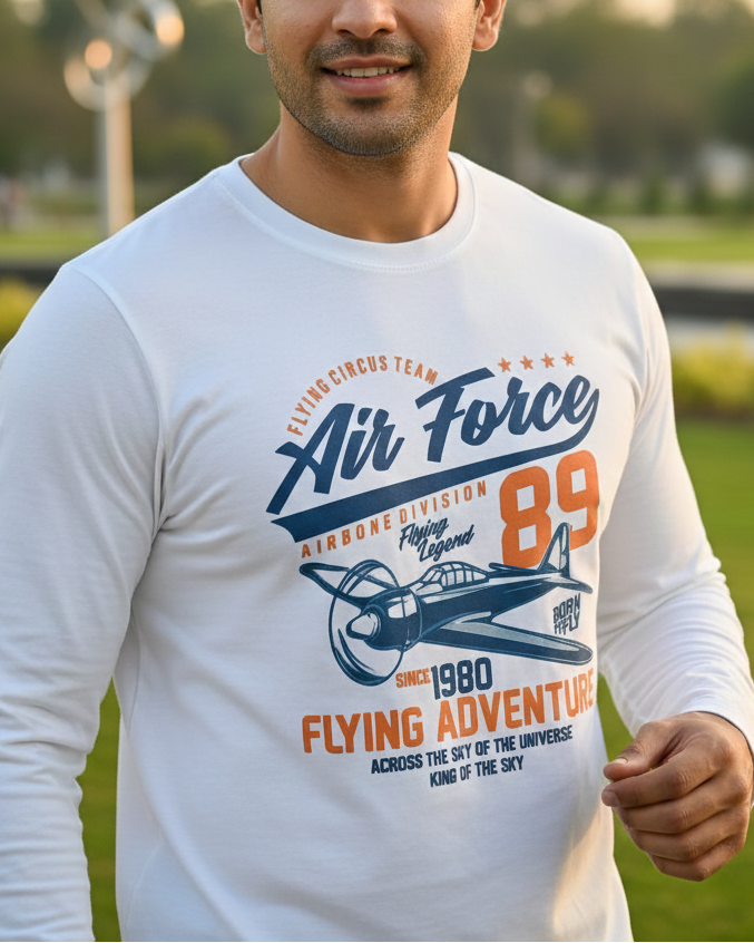 Man wearing a white t-shirt with 'Air Force' design outdoors