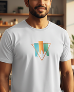 Man wearing a white t-shirt with a colorful geometric design in a casual setting.