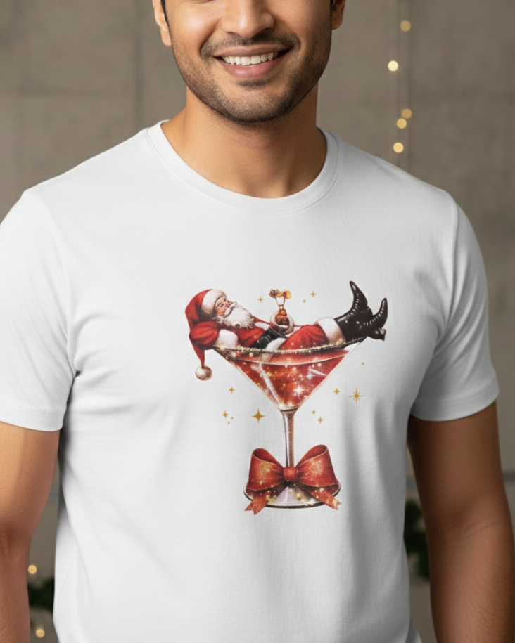 Man wearing a white t-shirt with a festive design of Santa Claus in a martini glass.
