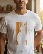 Man wearing a white t-shirt with a gold graphic design in a home setting