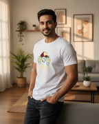Man wearing a white t-shirt with a graphic design in a living room.