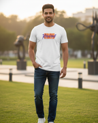 Man wearing a white t-shirt with colorful text design in an outdoor setting