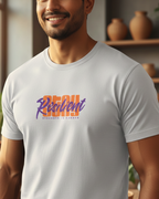 Man wearing a white t-shirt with colorful text in a home setting