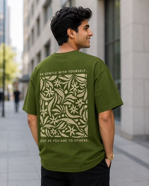 Young Man wearing Be Gentle print in Olive Green Oversized T-shirt