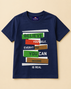 Navy T-shirt with Believe yourself print placed in light beige background