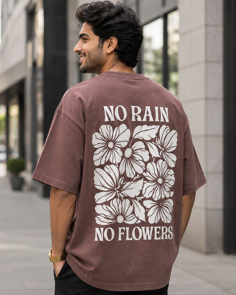 Man wearing No Rain No Flower print in Brown back view Oversized T-shirt