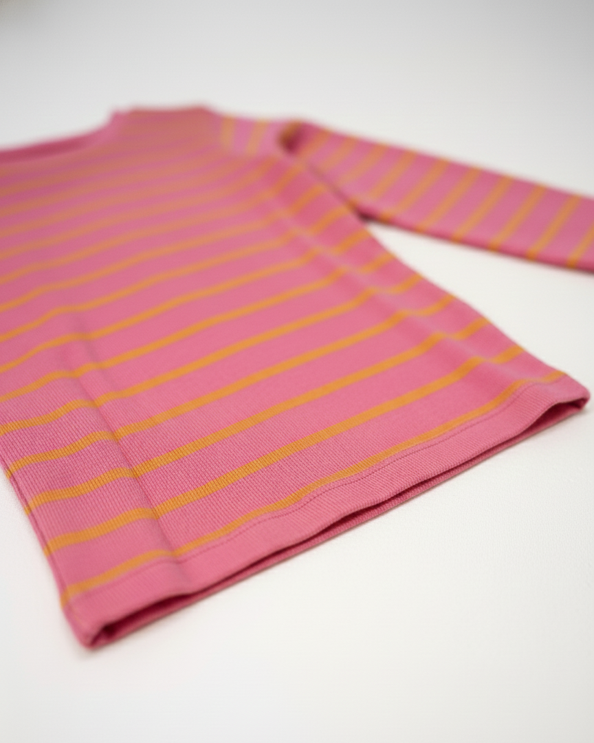 Pink and yellow striped shirt on a white background