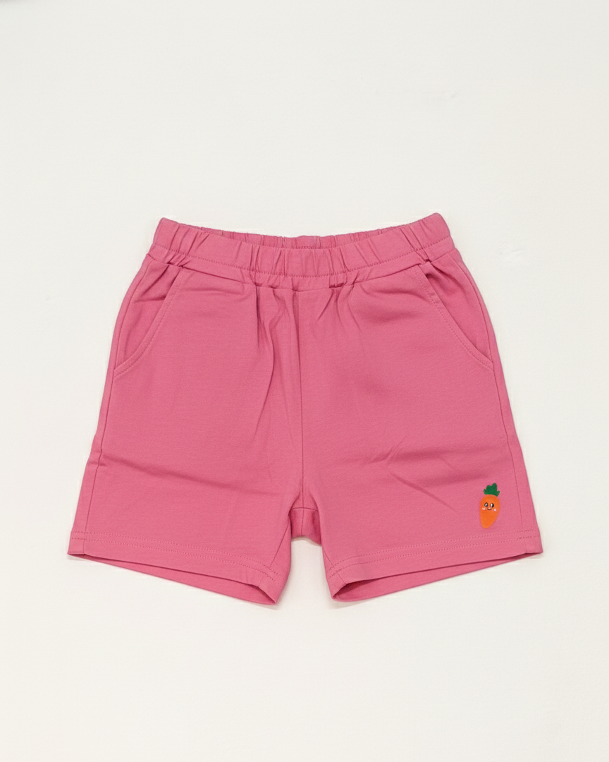 Pink shorts with a small embroidered design on a white background