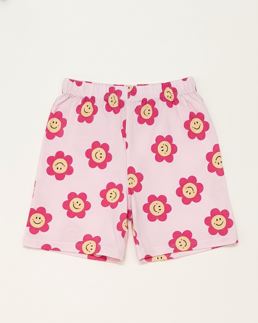 Pink shorts with flower pattern on a white background