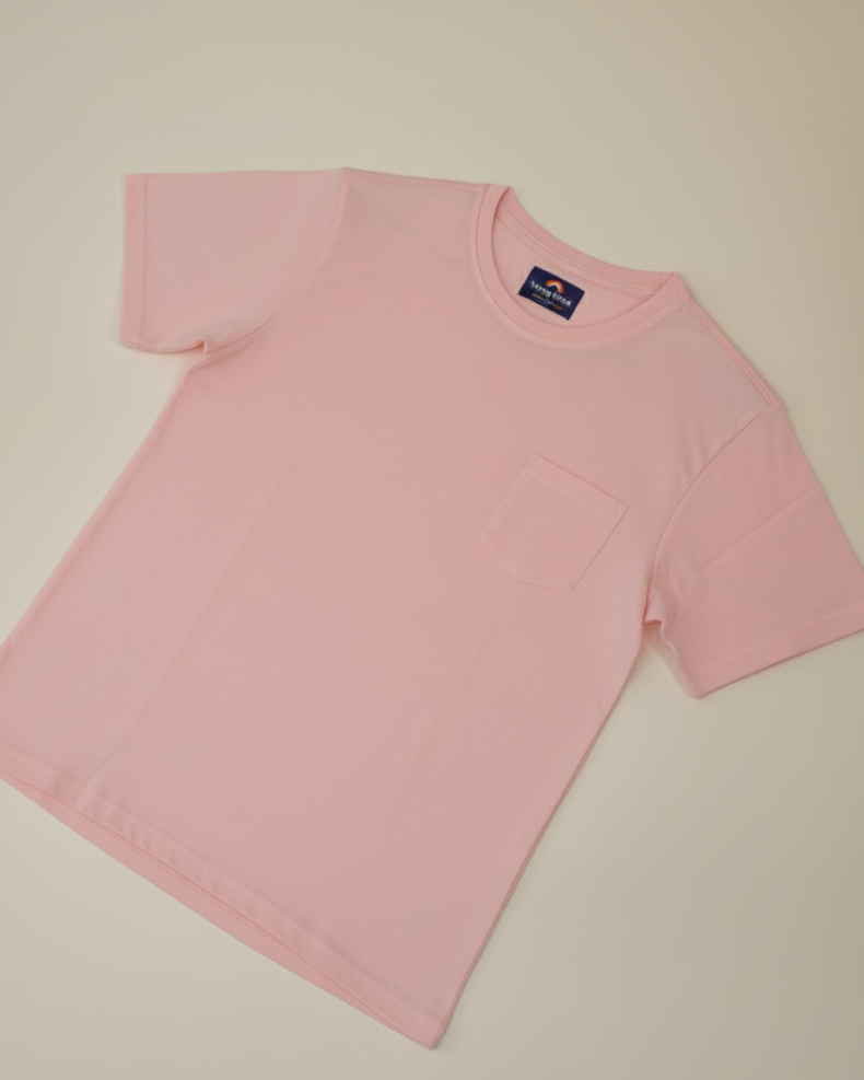 Pink t-shirt with a brand logo on a beige background