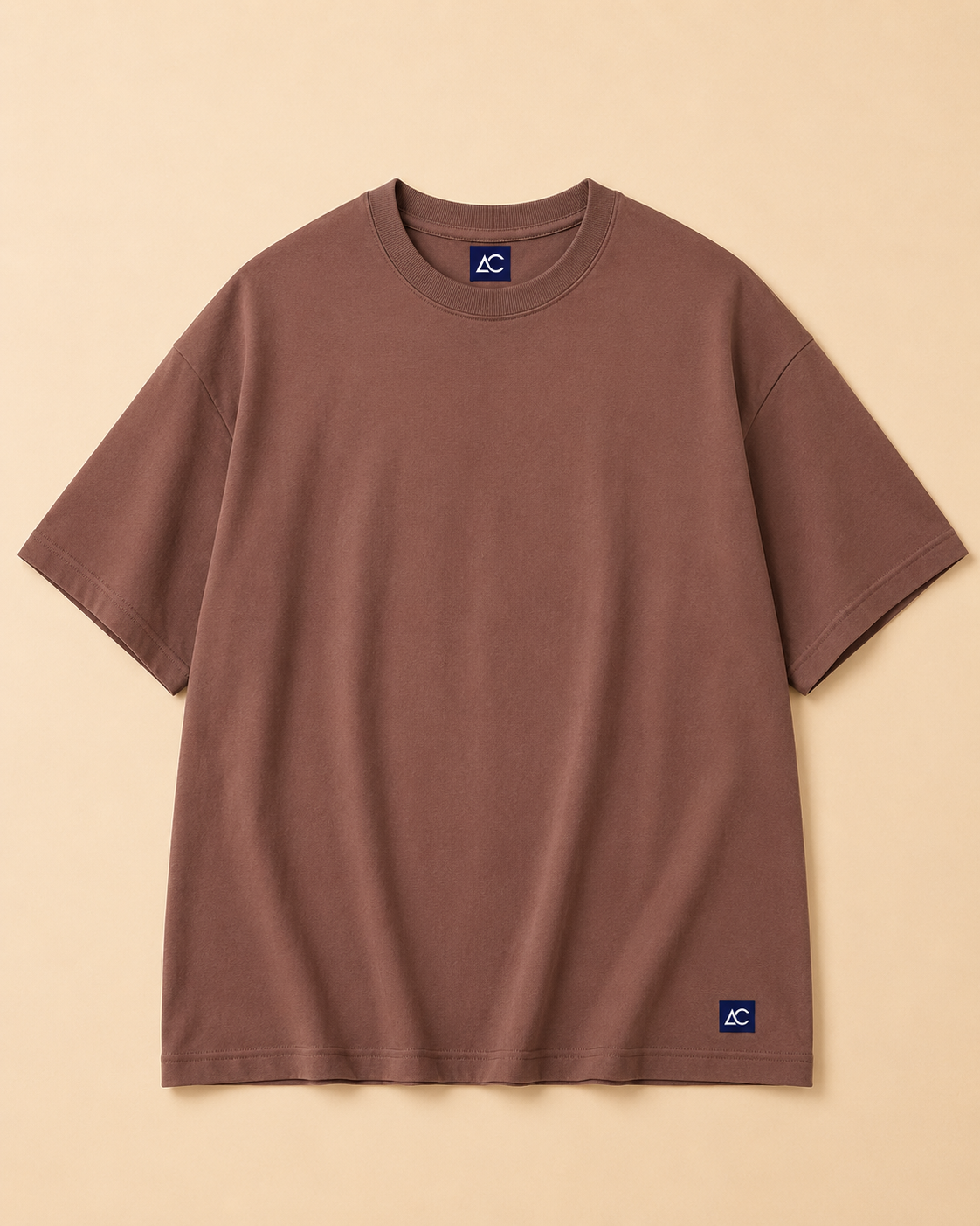 Plain Brown T-shirt placed on the Light Beige Background