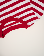 Red and white striped shirt on a beige background