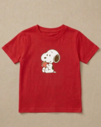 Red t-shirt with a cartoon character holding a heart on a beige background