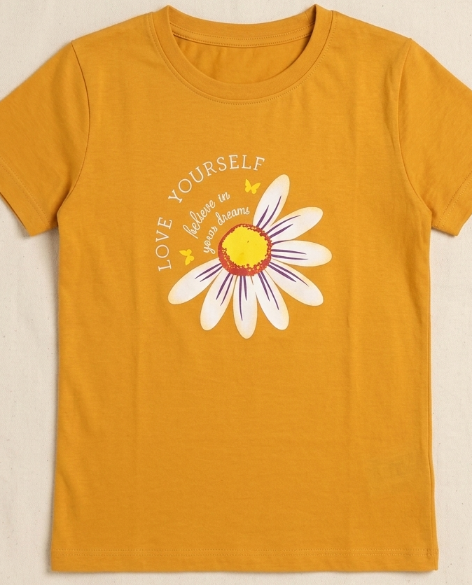 Rust orange  T-shirt with Sunflower print placed on the light beige background
