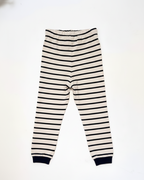 Striped pants with black and white stripes on a white background