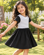 Stylish girls’ striped frock designed with a comfortable fit, short sleeves, and a playful flared skirt.