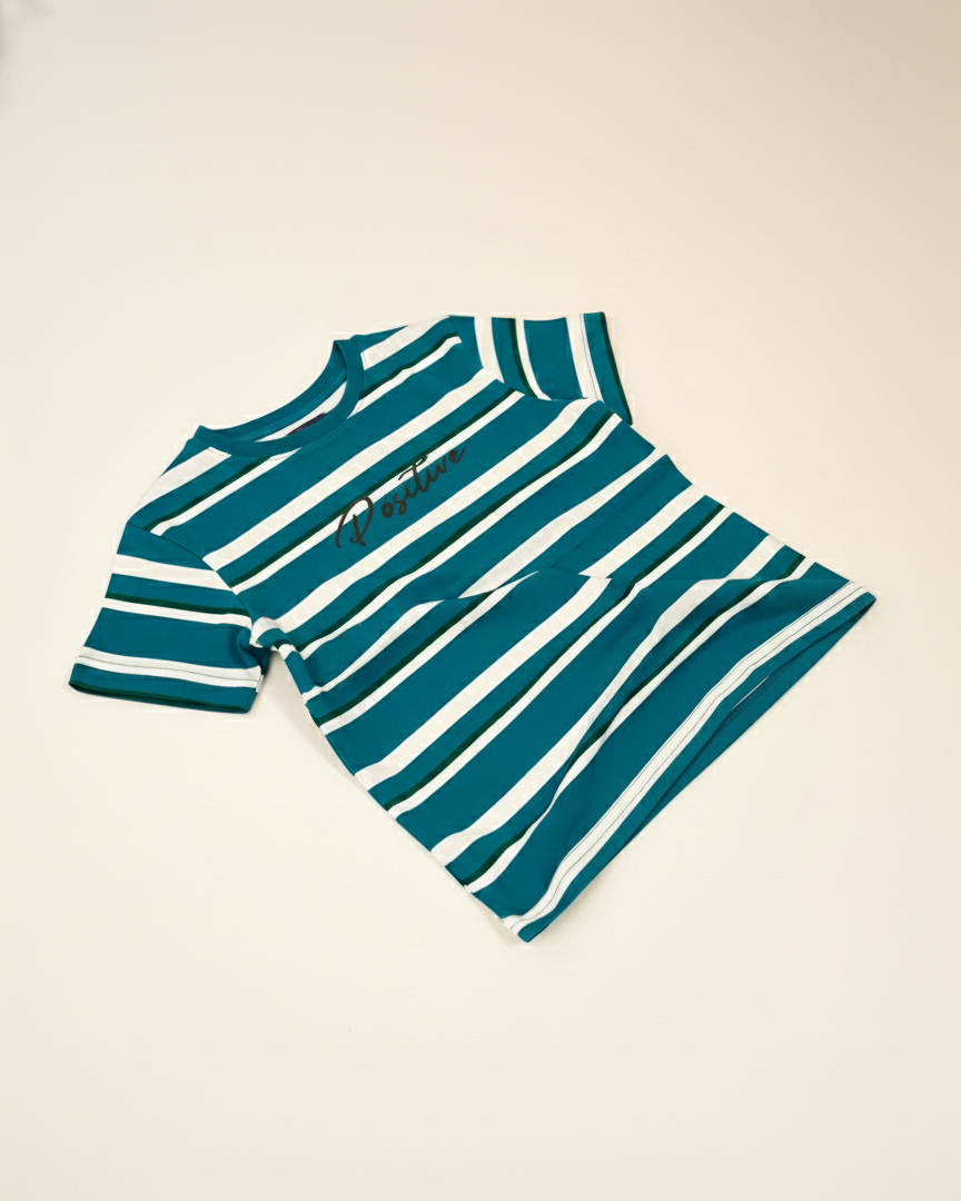 Teal and white striped shirt on a beige background.