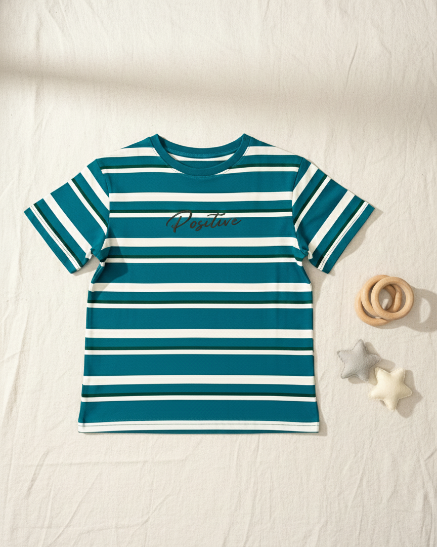 Teal and white striped shirt with 'Pacifica' text on a light wooden surface