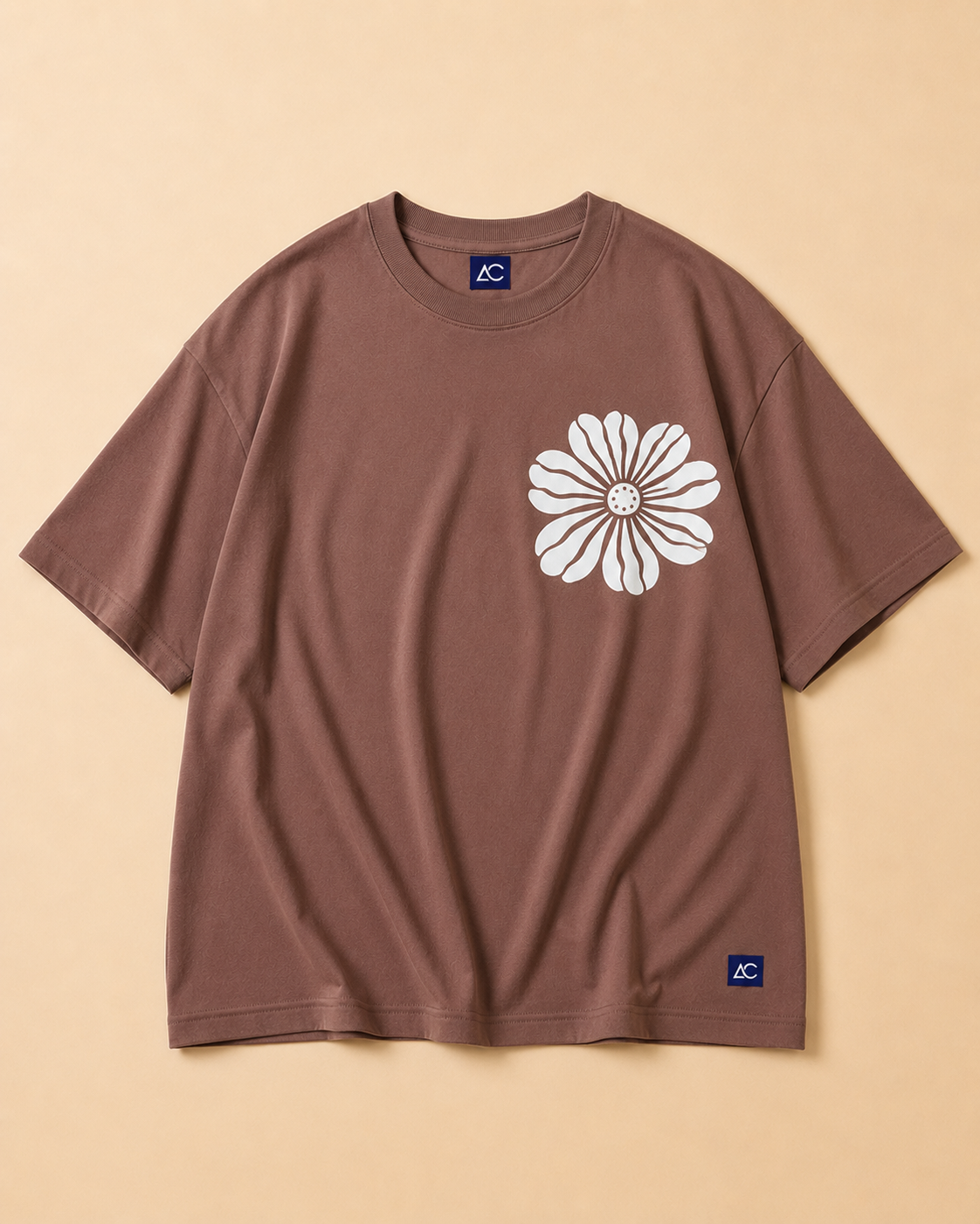 White Floral Print in Brown Oversized T-shirt placed on the Light beige background
