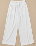 White Palazzo Pant placed on beige colour background