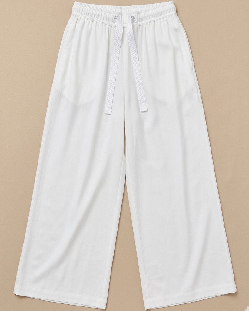 White Palazzo Pant placed on beige colour background