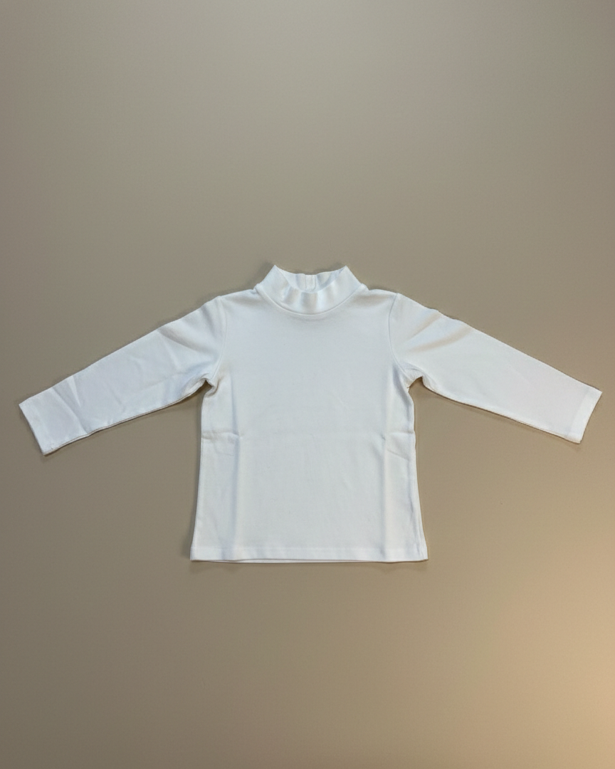 White long-sleeve shirt with a ruffled collar on a beige background