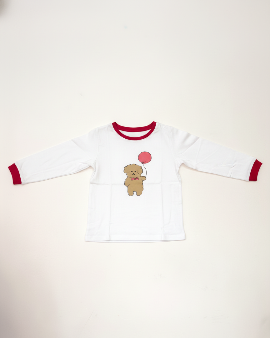 White long-sleeve shirt with red trim featuring a teddy bear design on a white background