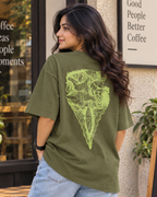 Woman wearing a Ship Sail in the sea print Olive Green oversized T-shirt