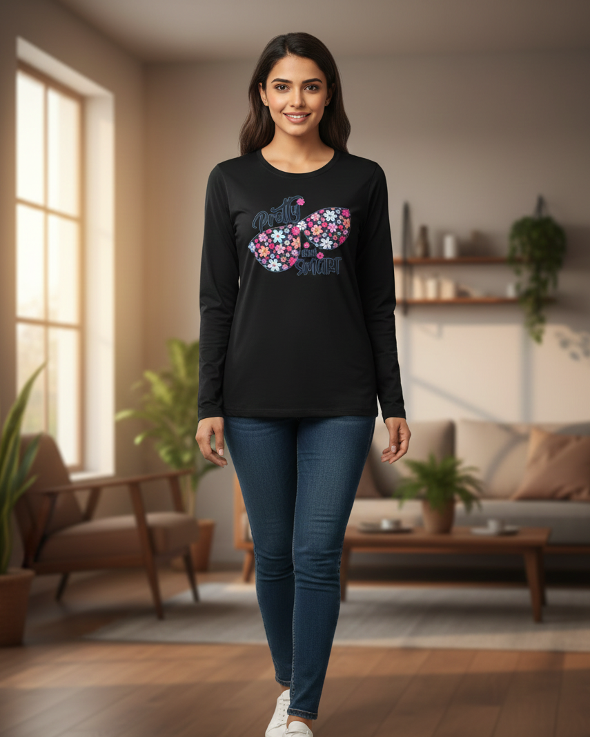 Woman wearing a black long-sleeve shirt with a colorful fish design in a living room.