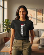 Woman wearing a black t-shirt with 'Be Consistent' text in a living room