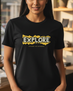 Woman wearing a black t-shirt with 'EXPLORE' printed on it in a casual setting.