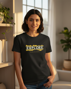 Woman wearing a black t-shirt with 'EXPLORE' printed on it in a home setting.