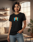 Woman wearing a black t-shirt with a colorful geometric design in a living room.