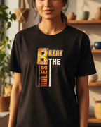 Woman wearing a black t-shirt with a colorful graphic design in a home setting