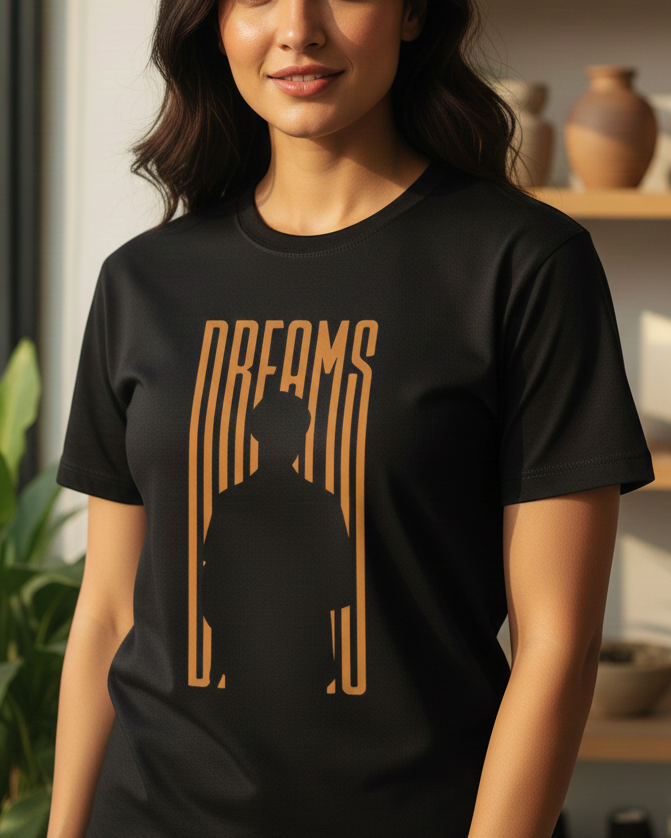Woman wearing a black t-shirt with a graphic design in a home setting