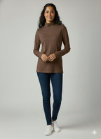 Woman wearing a brown long-sleeve top and blue jeans on a gray background