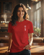 Woman wearing a red t-shirt with a logo in a restaurant setting