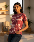 Woman wearing a tie-dye shirt in a bright living room