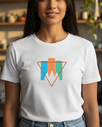 Woman wearing a white t-shirt with a colorful triangle design in a home setting