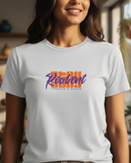 Woman wearing a white t-shirt with colorful text in a home setting