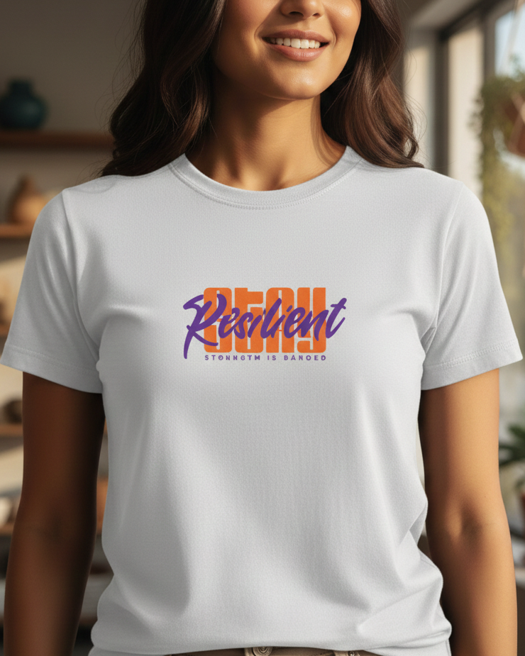 Woman wearing a white t-shirt with colorful text in a home setting