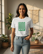 Woman wearing a white t-shirt with green text in a living room setting