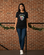 Women wearing a black t-shirt with a graphic design.