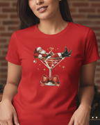 Women wearing a red t-shirt with a Christmas-themed design of Santa Claus in a martini glass.