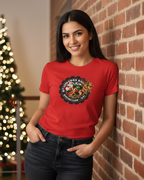 Women wearing a red t-shirt with a logo, standing in front of a decorated Christmas tree.