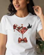 Women wearing a white t-shirt with a festive design of Santa Claus in a martini glass.