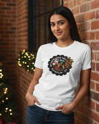 Women wearing a white t-shirt with a logo, standing in front of a decorated Christmas tree.