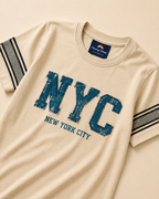 Yellow T-shirt with denim NYC print placed in light beige background