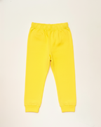 Yellow sweatpants on a beige background